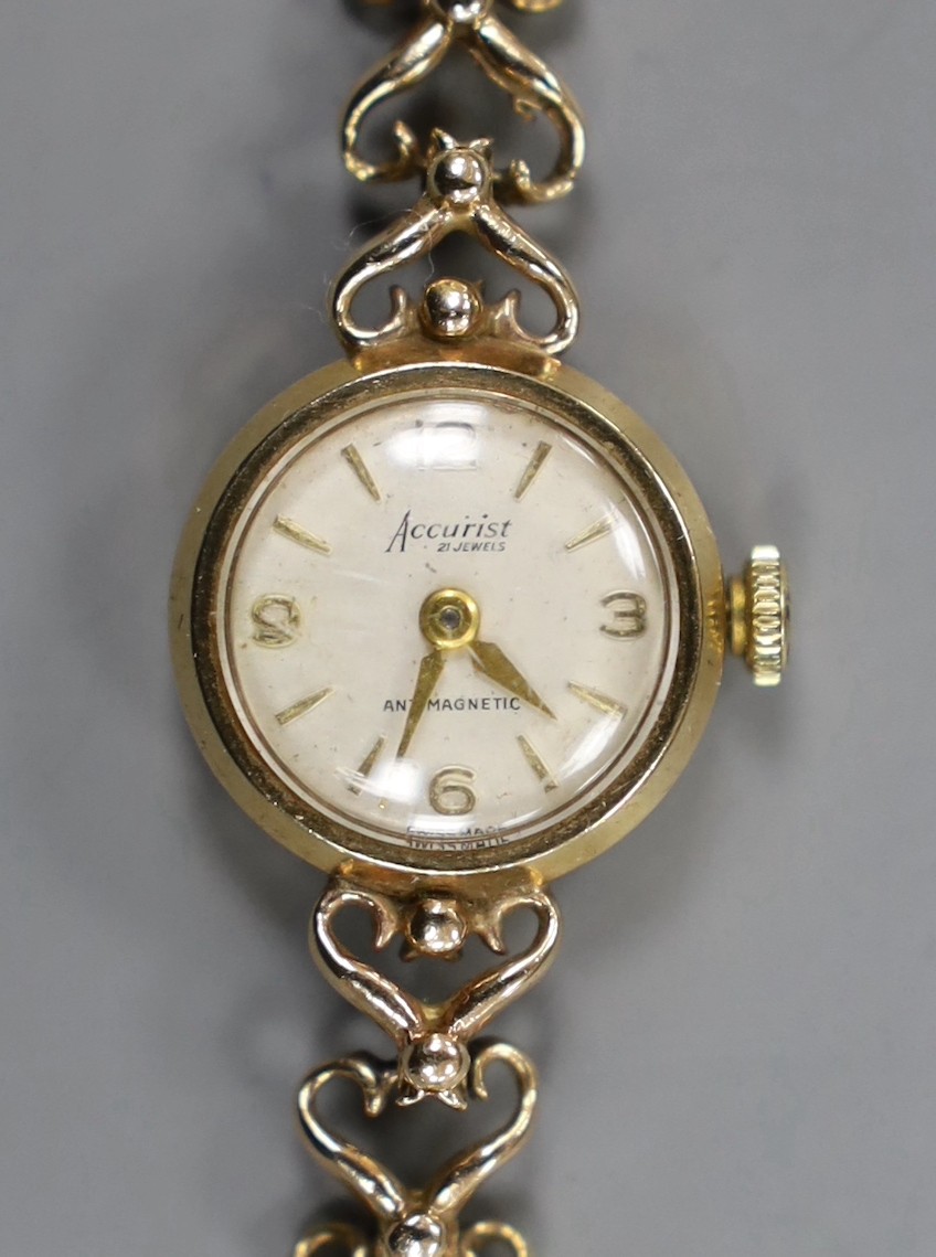 A lady's 9ct gold Accurist manual wind wrist watch, on a 9ct gold bracelet, overall 17.8cm, gross weight 14.1 grams.